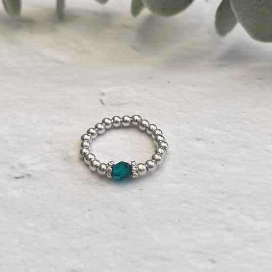 Handcrafted emerald crystal and sterling silver bead ring with stretch fit – a soothing stacking ring and May birthstone gift.