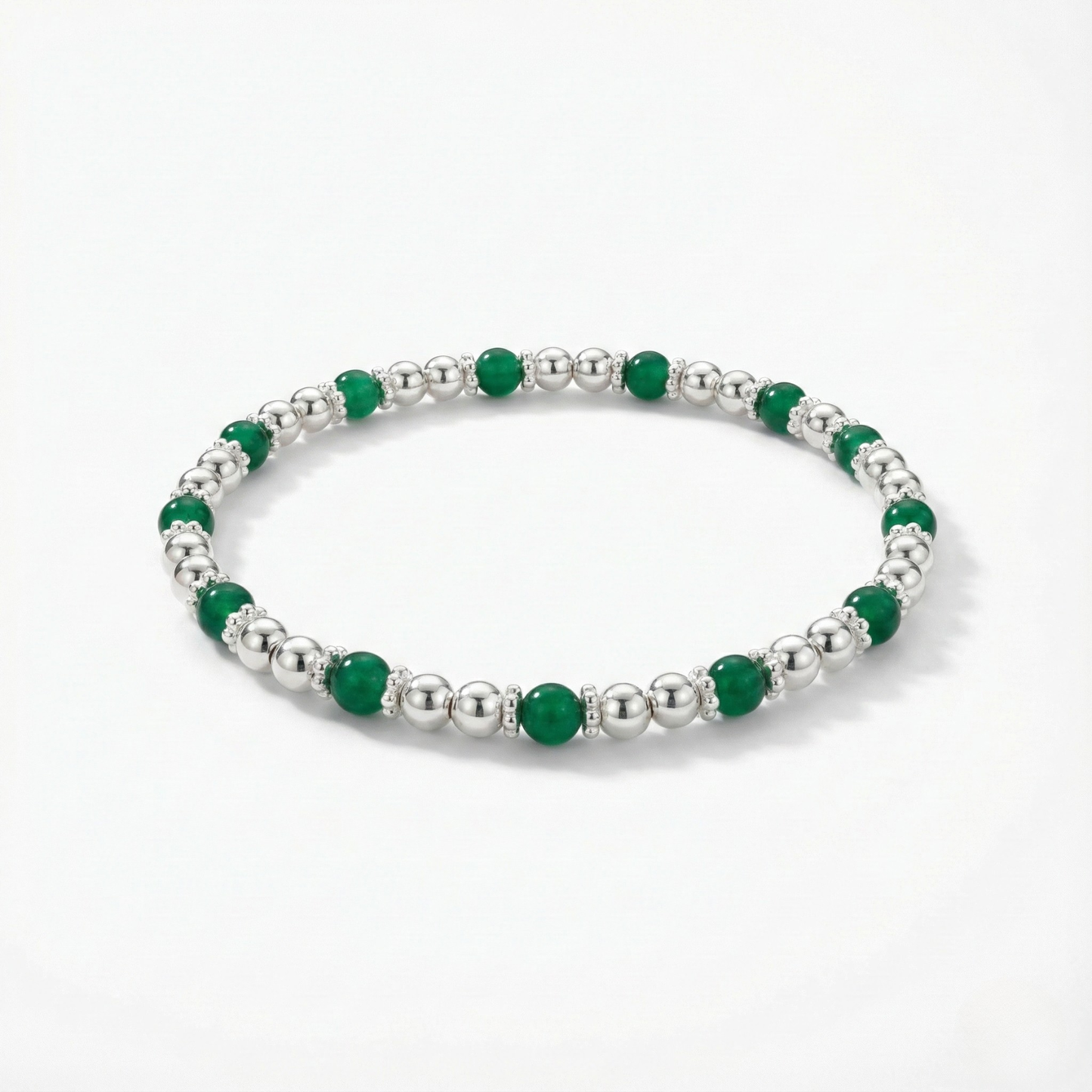 Green agate gemstone beaded bracelet with faceted green stones on a stretch design.