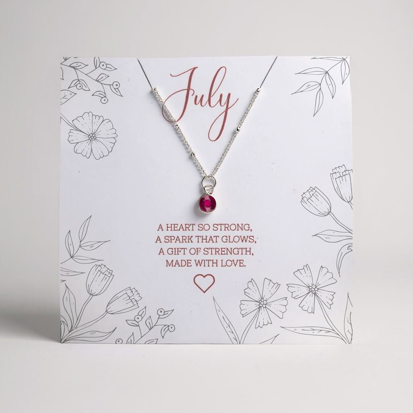 July ruby birthstone necklace, sterling silver necklace, personalised necklace for july birthday gift. Shown on a personalised message card.