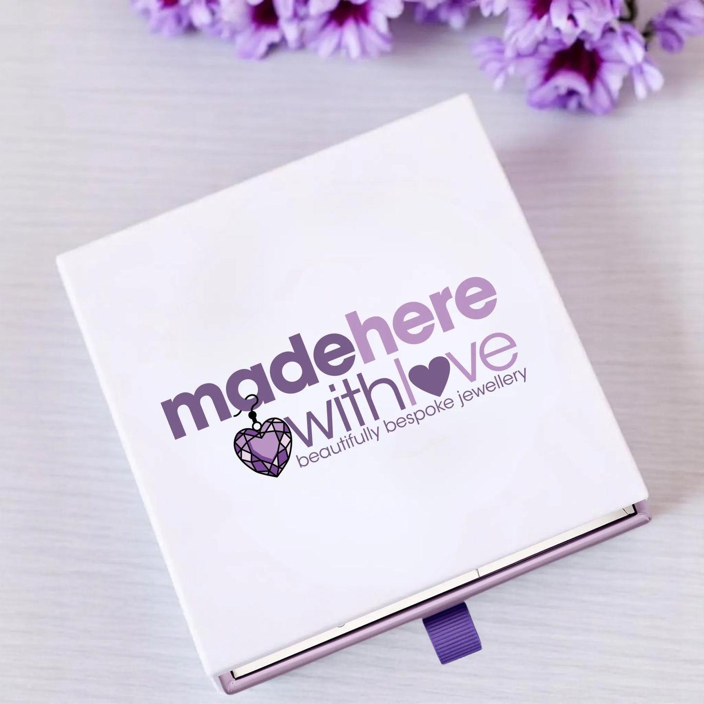 made here with love jewellery gift box, with a bright and classy logo and a purple ribbon pull tab this gift presentation is perfect for gifting.