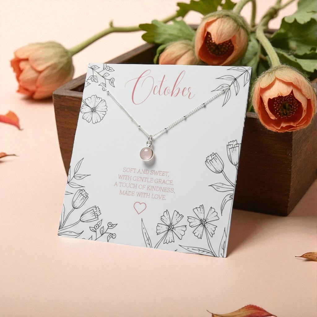 Rose Quartz Birthstone Necklace on illustrated October birthstone message card with sterling silver chain and rose details