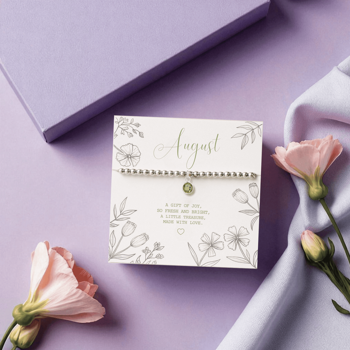 August peridot bracelet gift box with floral backing card and gemstone meaning message