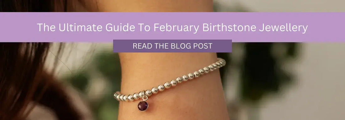 Close-up of a person's wrist wearing a beaded bracelet with a small purple gem charm. A purple banner above the wrist reads, "The Ultimate Guide to February Birthstone Jewellery" with a "Read the Blog Post" button beneath it.