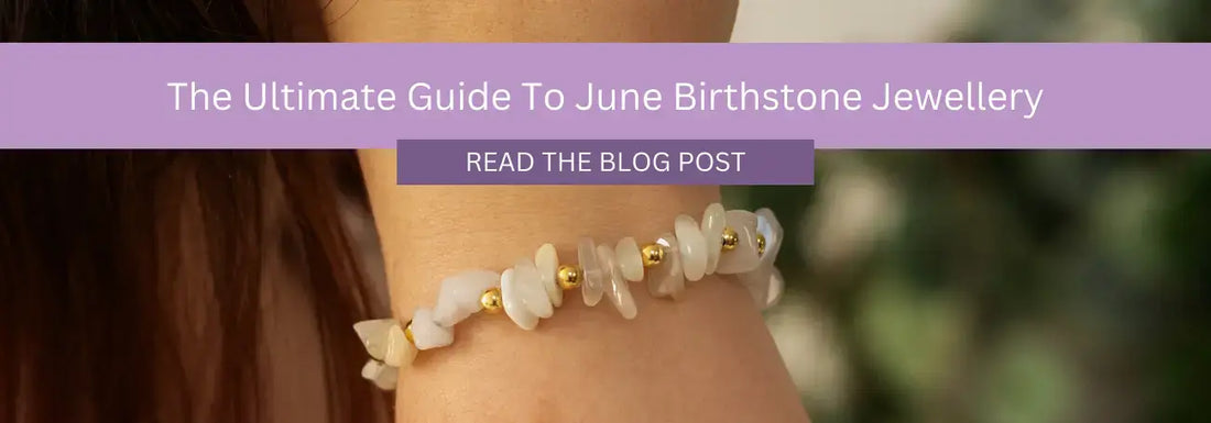  Close-up of a woman's wrist wearing a bracelet made of light-colored stones and small gold beads. A purple banner across the top reads, "The Ultimate Guide To June Birthstone Jewellery," with a button below labeled "Read the Blog Post."