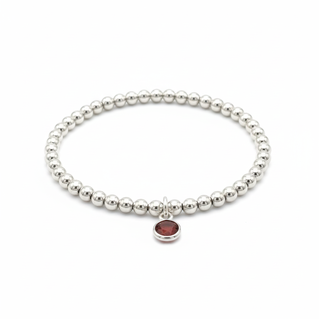 January birthstone garnet charm bracelet with rich red gemstone and sterling silver stretch beads.