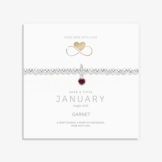 January birthstone bracelet - deep red garnet charm on sterling silver stretch bead bracelet