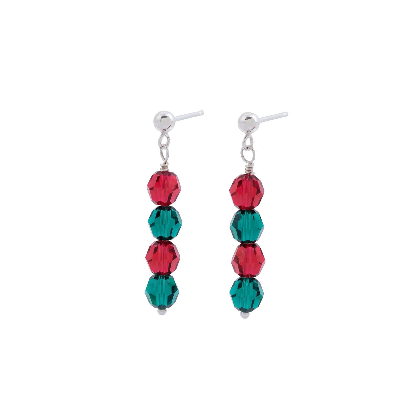 A pair of Scarlet and Emerald Crystal Earrings by Made Here with Love, with each featuring three faceted beads. The beads are alternately colored in red and green, attached vertically to sterling silver posts with small silver spheres at the top. The earrings hang down in a simple, elegant design.