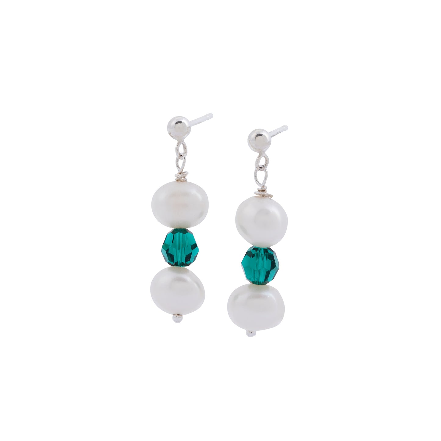 A pair of elegant Pearl and Emerald Earrings by Made Here with Love featuring two white freshwater pearls and a single green crystal bead in the center. The earrings hang from small sterling silver studs.