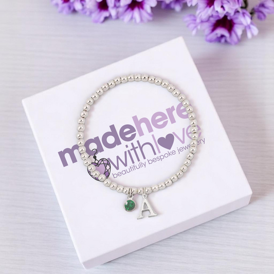 Initial and May birthstone charm bracelet made with sterling silver beads – personalised birthstone bracelet with green charm and chosen initial.