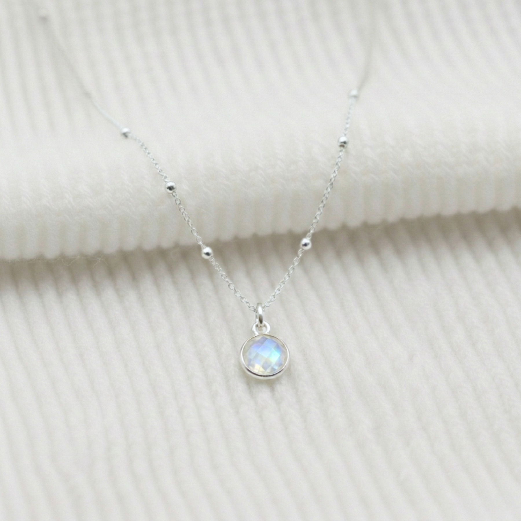 Moonstone charm necklace in sterling silver, June birthstone jewellery UK