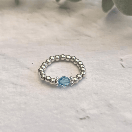 A handcrafted **Silver Aquamarine Ring** by **Made Here with Love** featuring a stunning blue Aquamarine Austrian Crystal.