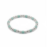 Amazonite bead stacking bracelet with soft blue gemstones and polished sterling silver beads on a stretch design.