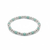 Amazonite bead stacking bracelet with soft blue gemstones and polished sterling silver beads on a stretch design.