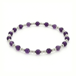 Amethyst bead bracelet with faceted purple gemstones on a stretch bracelet design.