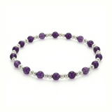Amethyst bead bracelet with faceted purple gemstones on a stretch bracelet design.