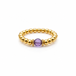 February birthstone Amethyst crystal ring with a faceted purple gemstone set on a gold filled bead ring.