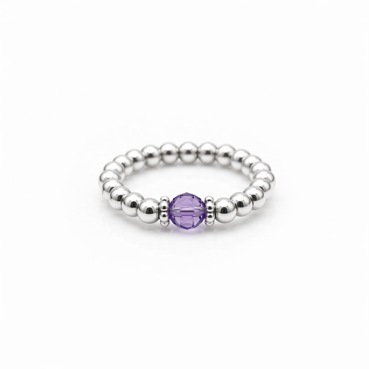February birthstone Amethyst crystal ring with a faceted purple gemstone set on a sterling silver bead ring.