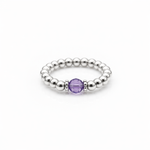 February birthstone Amethyst crystal ring with a faceted purple gemstone set on a sterling silver bead ring.