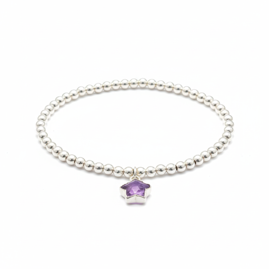 Sterling silver amethyst star charm bracelet featuring February birthstone gemstone