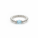 Aquamarine gemstone bead ring with pale blue stone and sterling silver stretch beads.