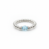 Aquamarine gemstone bead ring with pale blue stone and sterling silver stretch beads.