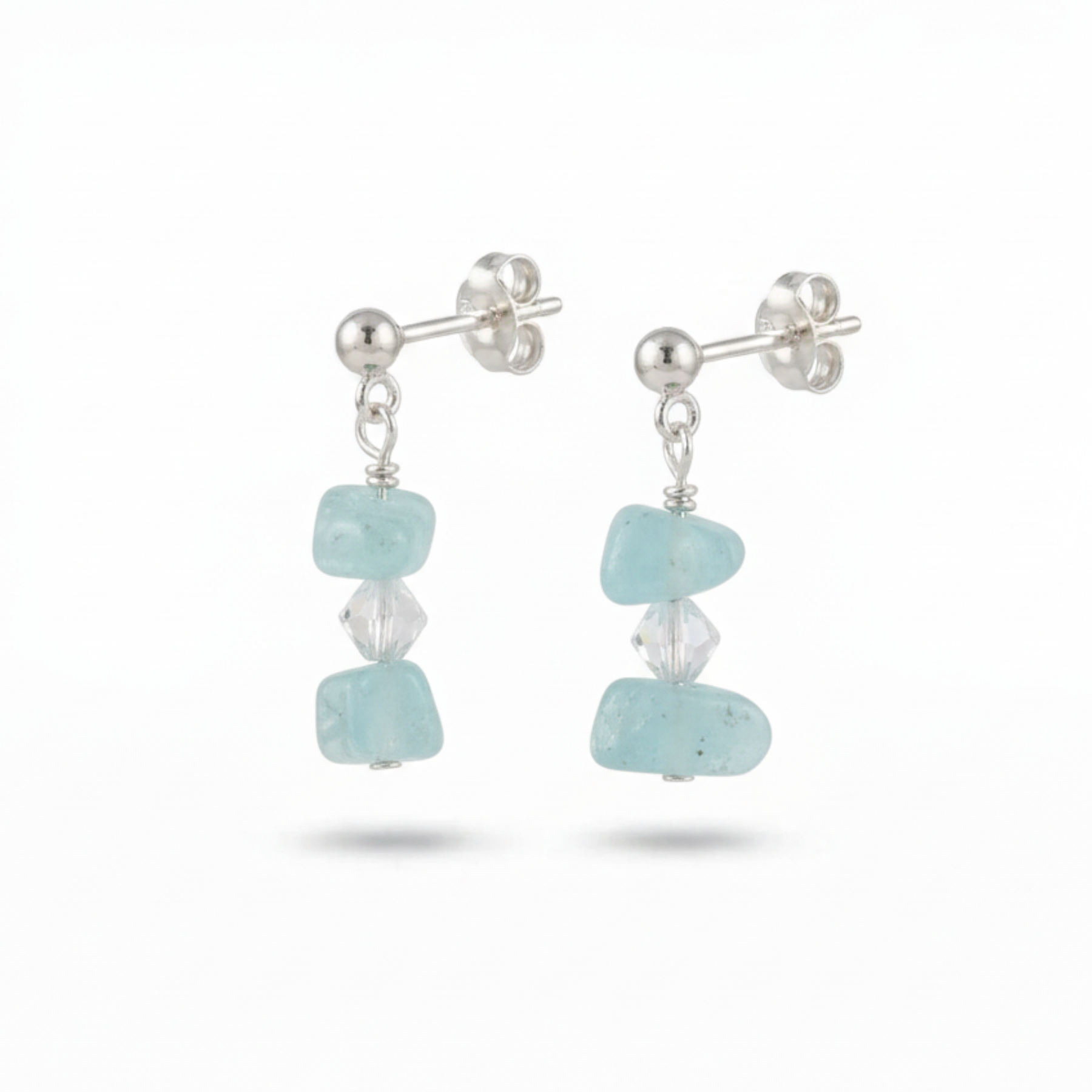 Sterling silver aquamarine gemstone earrings featuring pale blue stones, March birthstone jewellery gift for her.