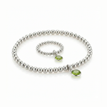 August birthstone jewellery set featuring a peridot bead ring and matching sterling silver bracelet.