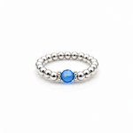 capri blue crystal ring with a faceted blue gemstone set on a sterling silver bead ring.