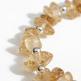 Close up detail of citrine chip bead bracelet in warm golden tones, natural November birthstone jewellery