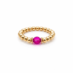 fuchsia crystal ring with a faceted pink gemstone set on a gold filled bead ring