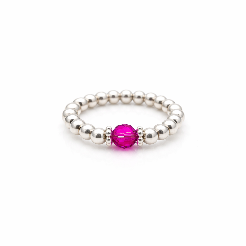 fuchsia crystal ring with a faceted pink gemstone set on a gold filled bead ring.