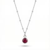 January garnet birthstone pendant necklace with deep red gemstone on sterling silver chain.
