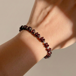 Garnet stretch bead bracelet with crystal details, January birthstone jewellery UK