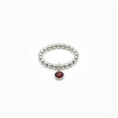 stretchy sterling silver bead ring with red gemstone charm - january garnet birthstone 