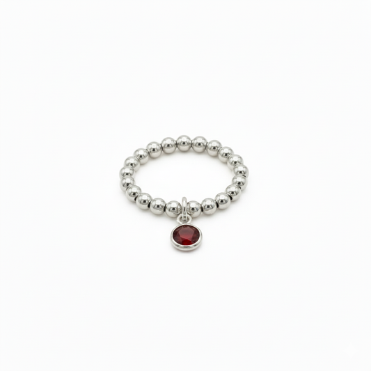 stretchy sterling silver bead ring with red gemstone charm - january garnet birthstone 