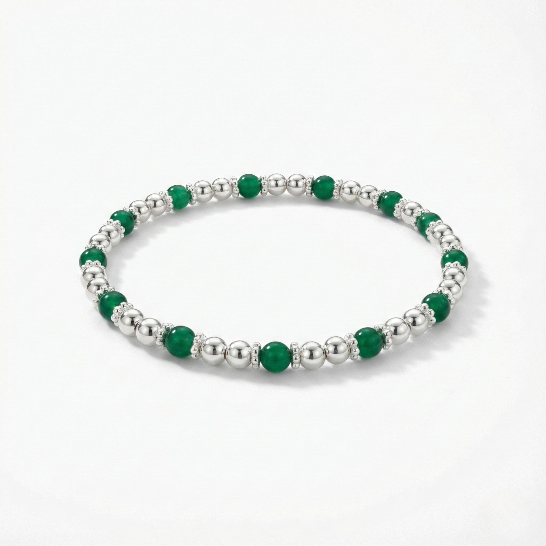 Green agate gemstone beaded bracelet with faceted green stones on a stretch design.