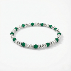 Green agate gemstone beaded bracelet with faceted green stones on a stretch design.