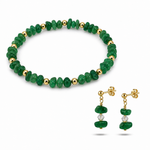 Green beaded bracelet and earrings on a white background