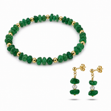 Green beaded bracelet and earrings on a white background