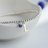 Initial and birthstone bracelet with sapphire charm, September jewellery UK