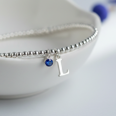 Initial and birthstone bracelet with sapphire charm, September jewellery UK