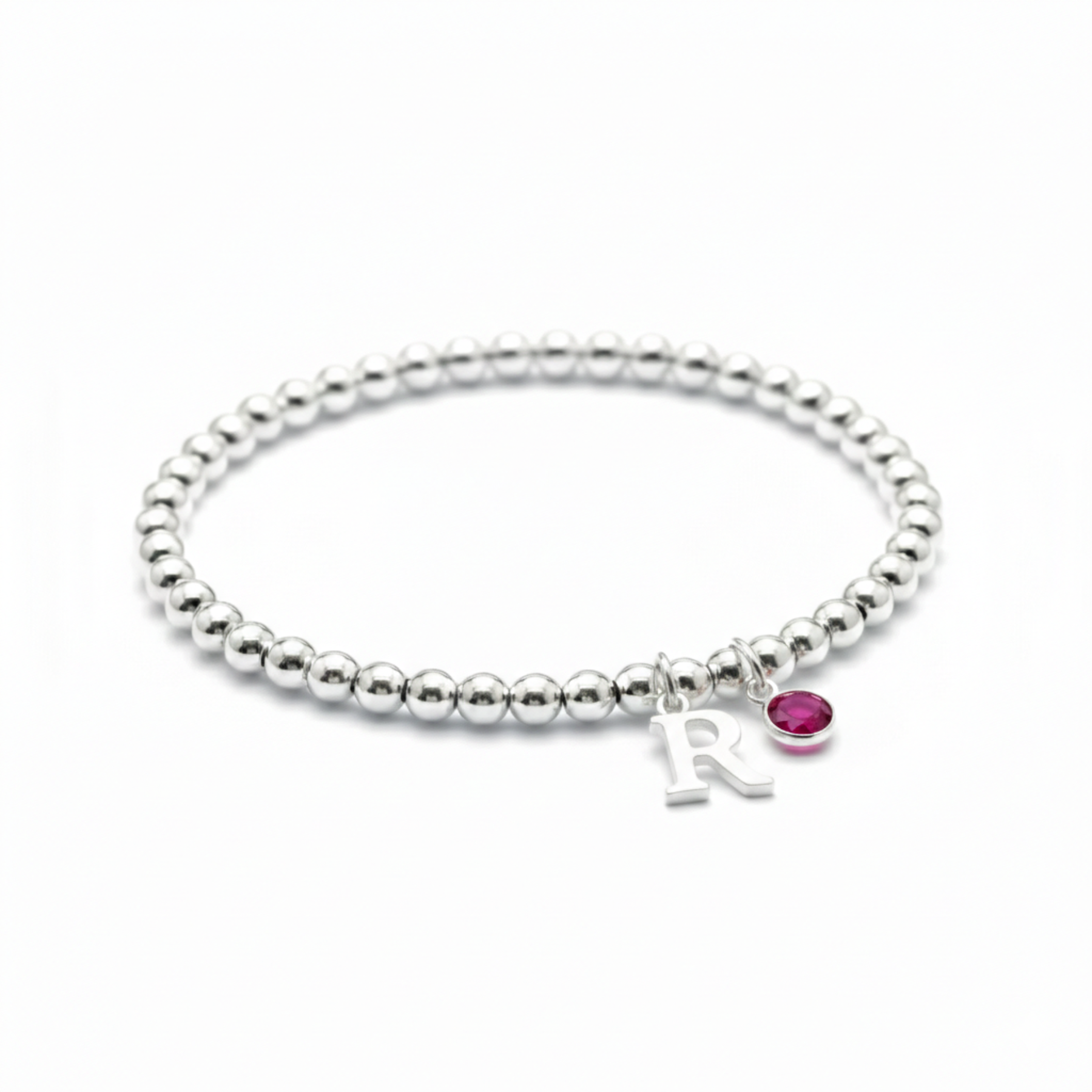 July ruby birthstone and initial sterling silver bead stretch bracelet, personalised birthday gift