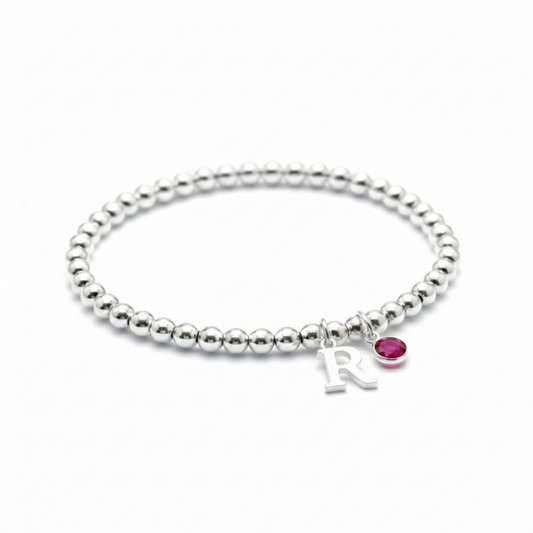 July ruby birthstone and initial sterling silver bead stretch bracelet, personalised birthday gift