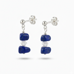 Lapis lazuli gemstone drop earrings in sterling silver with deep celestial blue stones and subtle golden flecks, meaningful September birthstone jewellery.