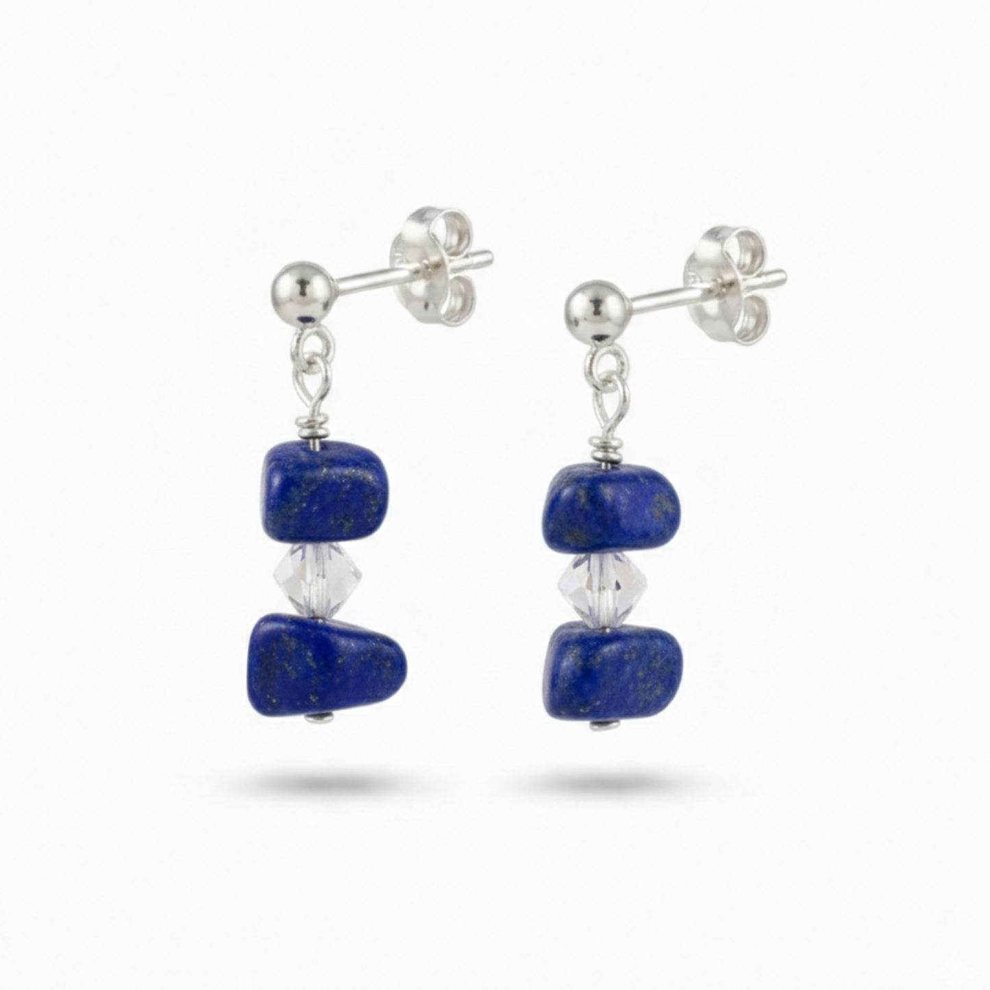 Lapis lazuli gemstone drop earrings in sterling silver with deep celestial blue stones and subtle golden flecks, meaningful September birthstone jewellery.