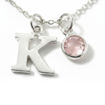 October birthstone and initial necklace featuring rose quartz gemstone in sterling silver, personalised birthday gift.