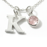 October birthstone and initial necklace featuring rose quartz gemstone in sterling silver, personalised birthday gift.