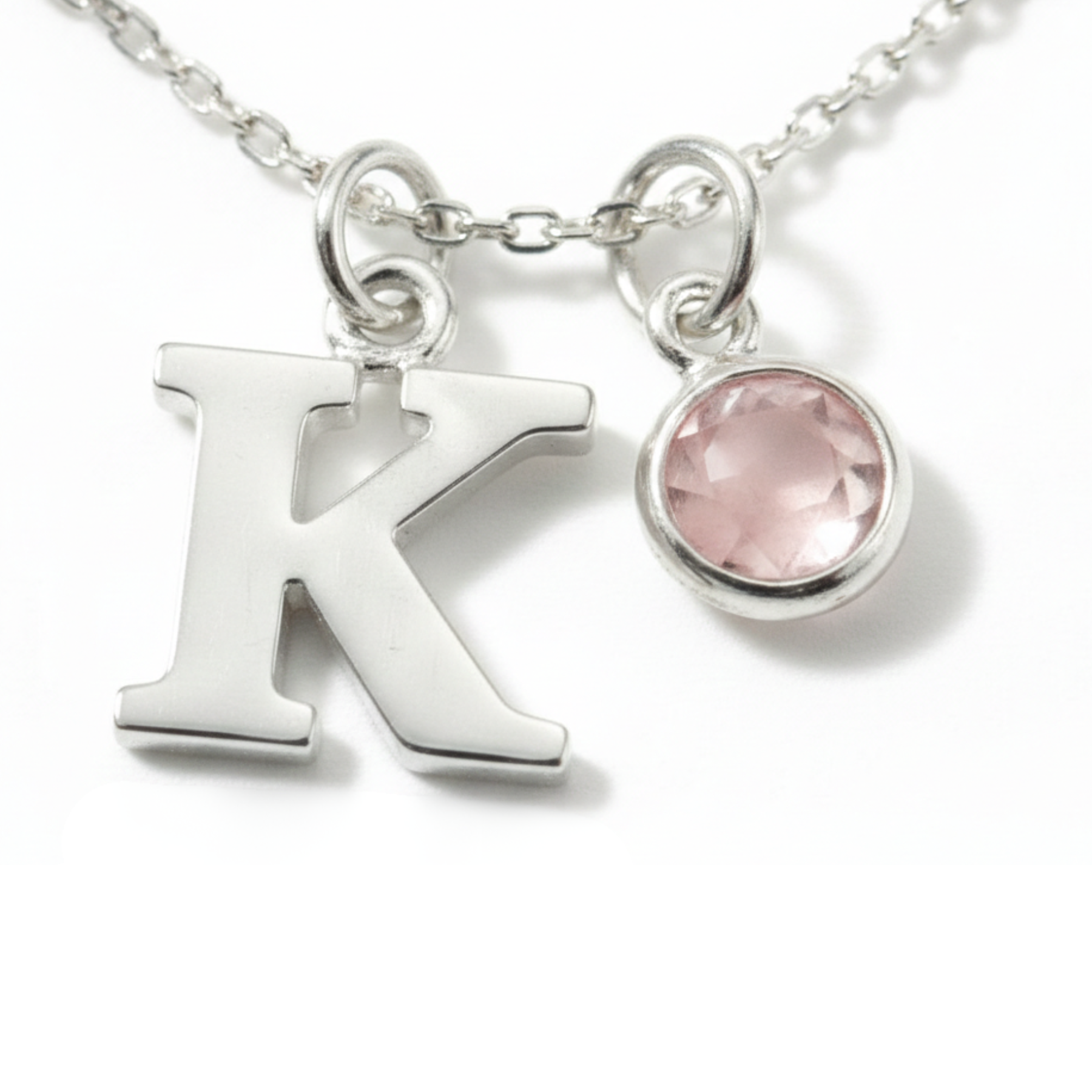October birthstone and initial necklace featuring rose quartz gemstone in sterling silver, personalised birthday gift.