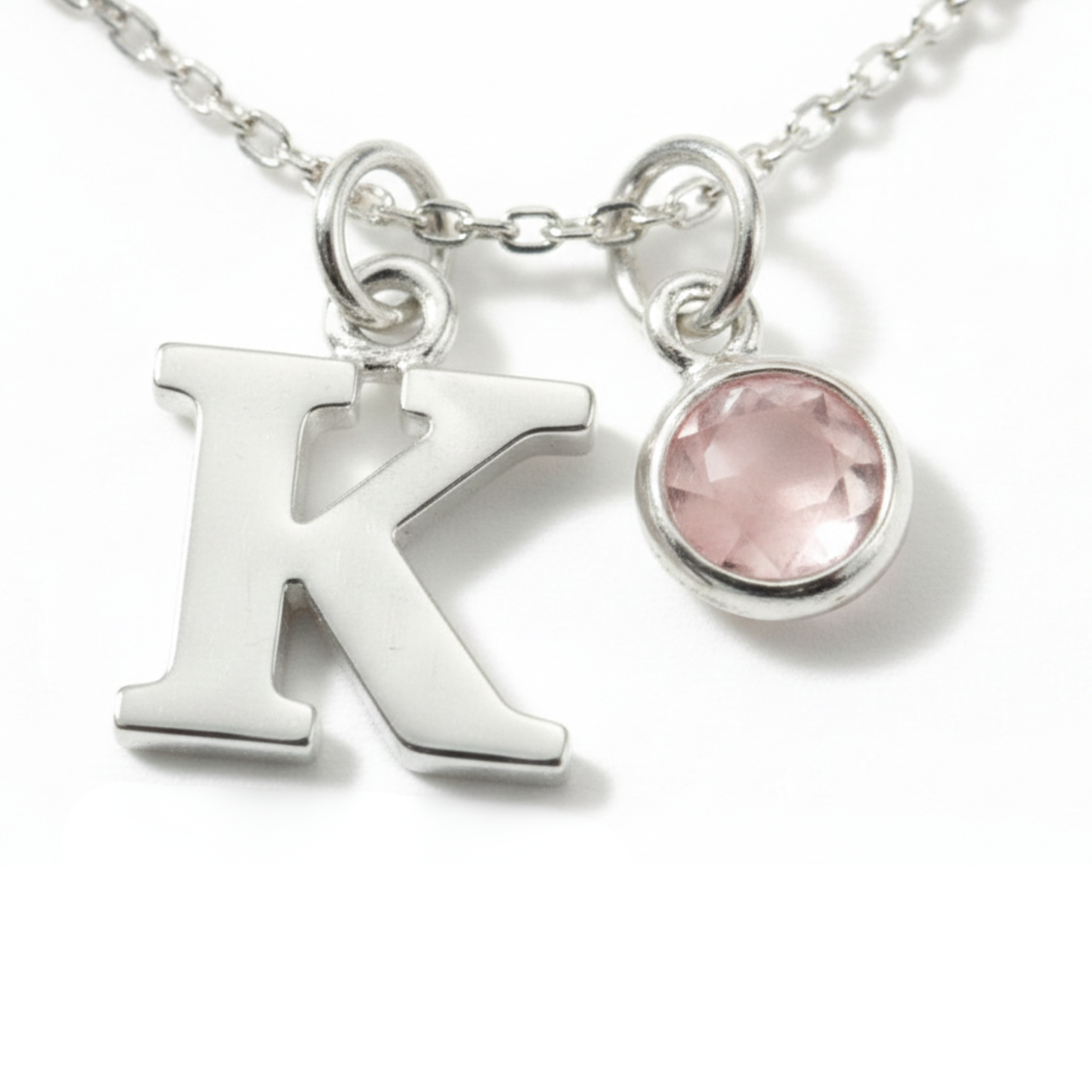 October birthstone and initial necklace featuring rose quartz gemstone in sterling silver, personalised birthday gift.