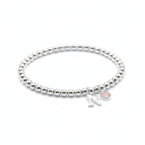 October birthstone and initial personalised bracelet with amethyst gemstone on a sterling silver stretch bracelet.